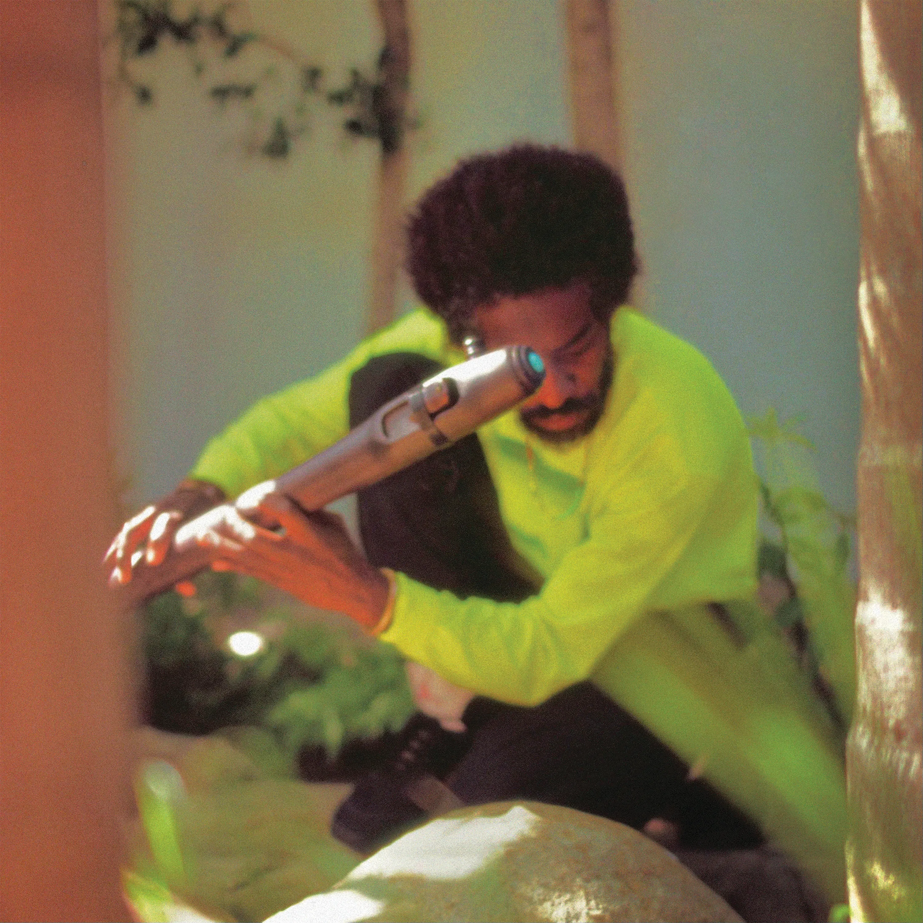 Andre 3000 Playing the flute in New Blue Sun Album Cover