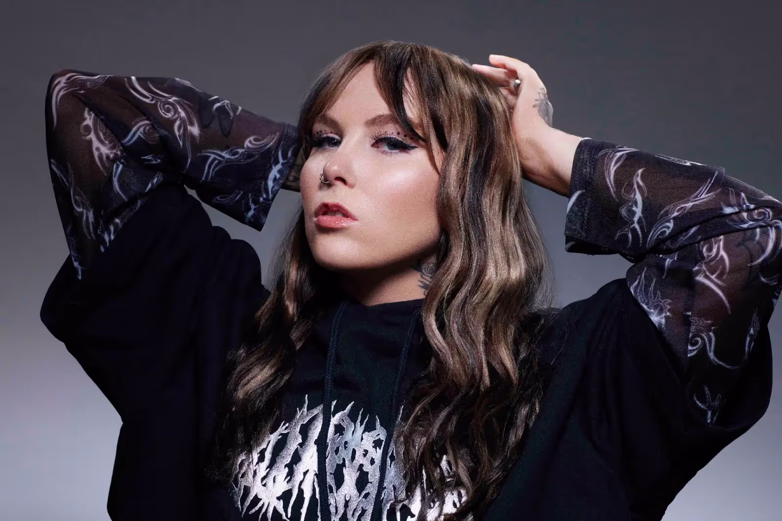 Kenya Grace wearing black top