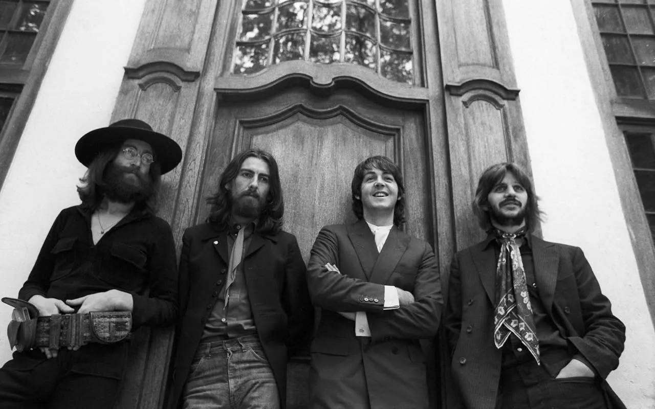 The Beatles black and white photo by the door