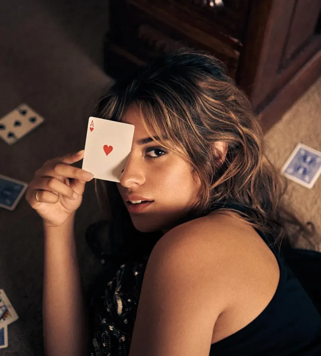 Camila Cabello, holding Ace of Hearts
