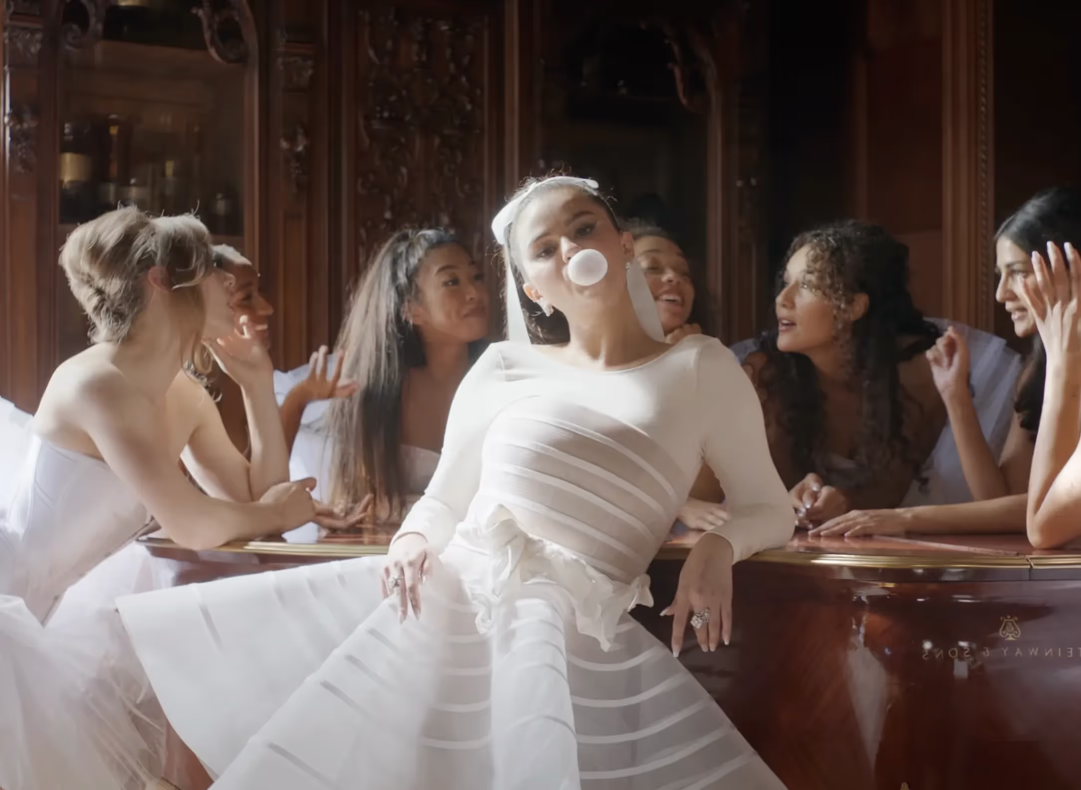 Selena Gomez surrounded by dancers in "Love On" music video