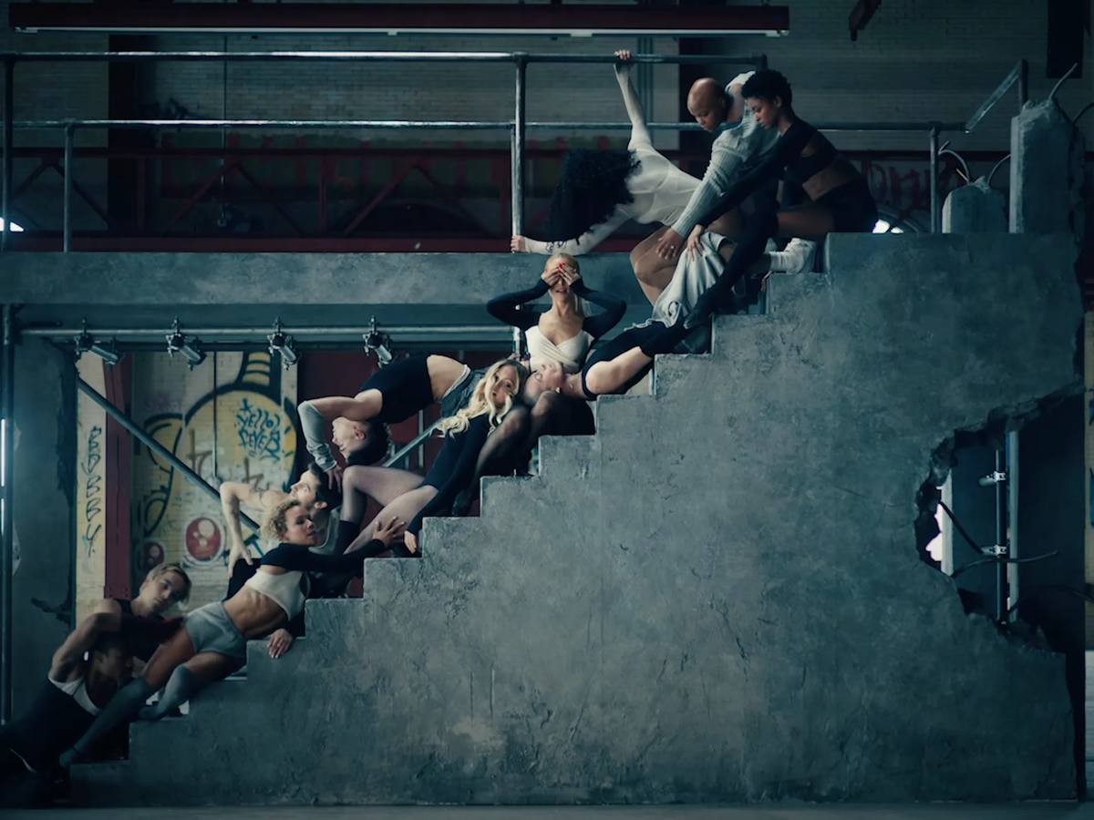 Ariana Grane on a staircase with her dancers in 'yes, and' music video