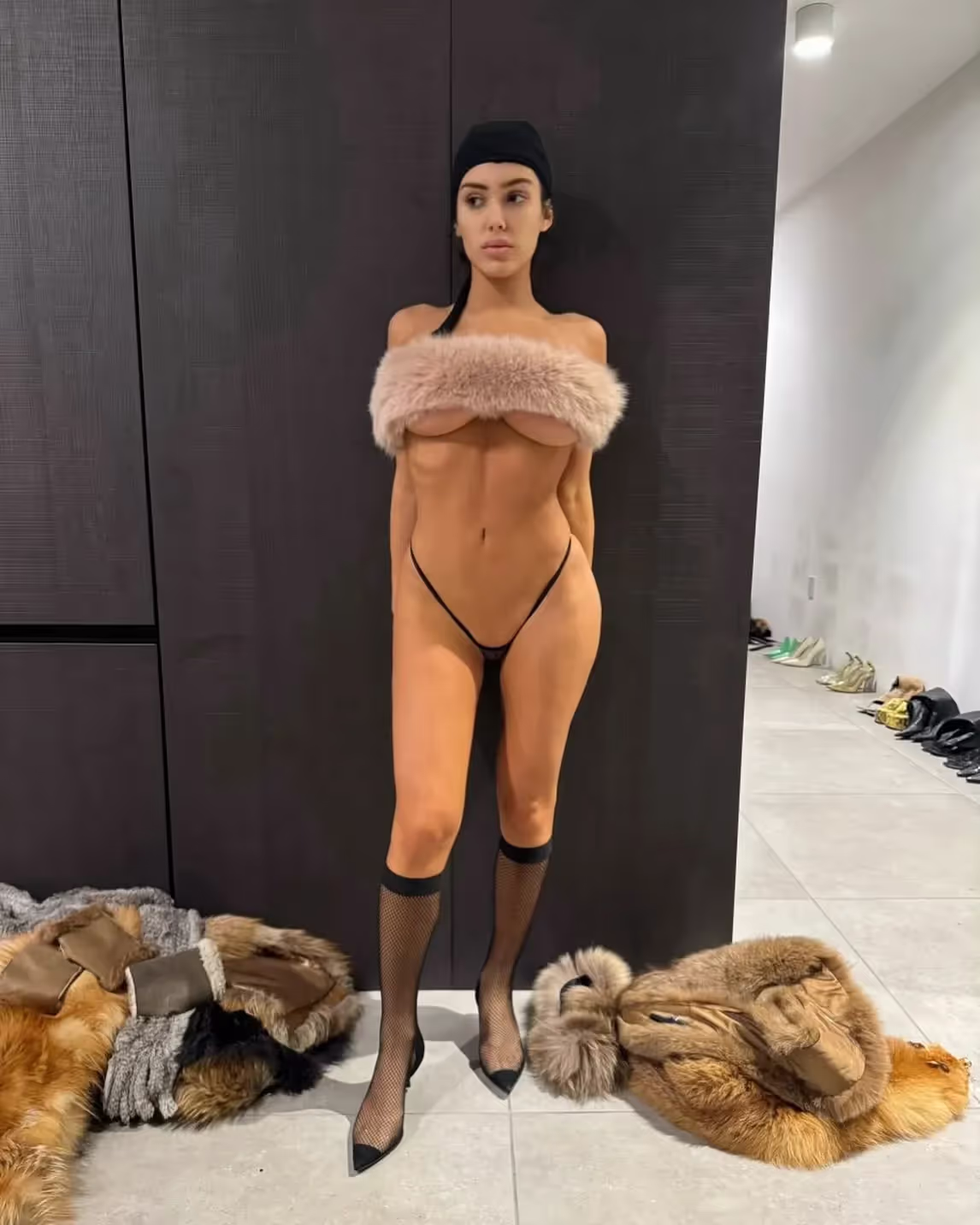 Bianca Censori wearing tiny black thong and DIY fur top via Kanye West's IG