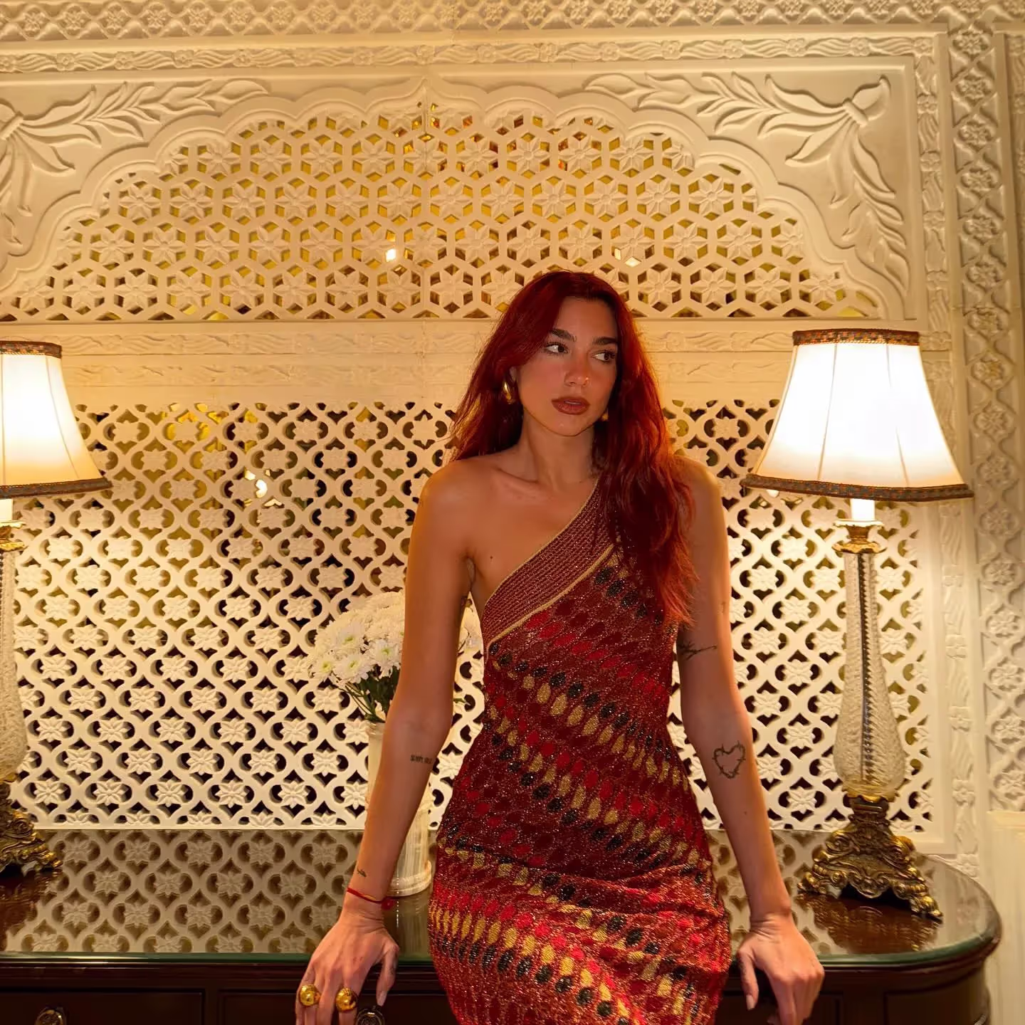 Dua Lipa stuns in red and gold dress during her holiday vacation in India