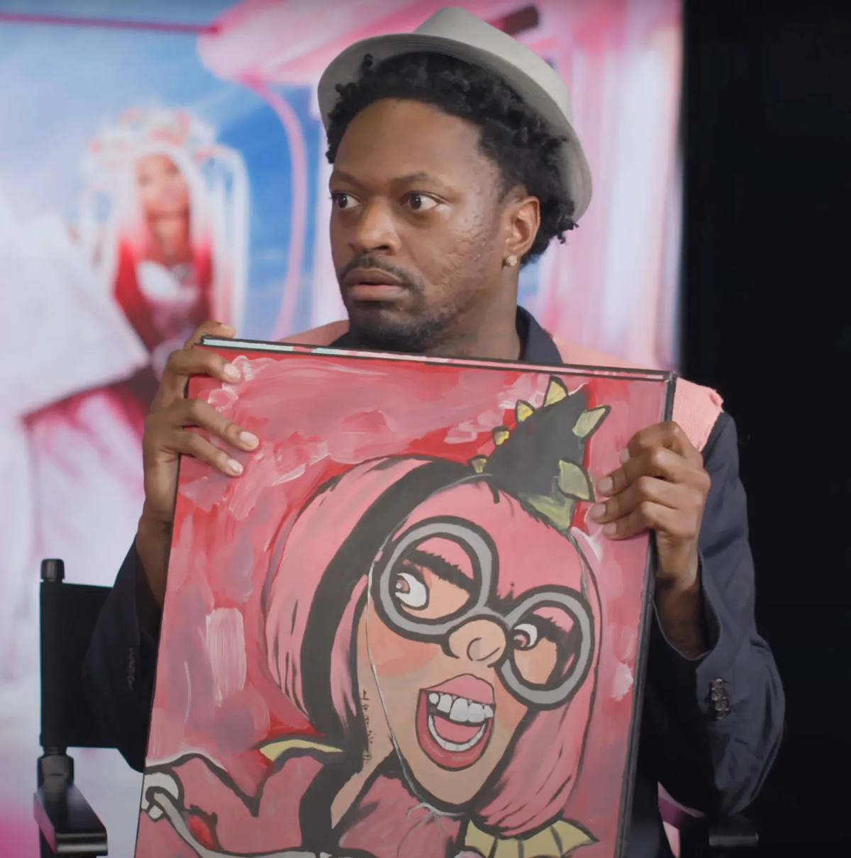 Funny Marco holds Portrait of Nicki Minaj, depicting Roman