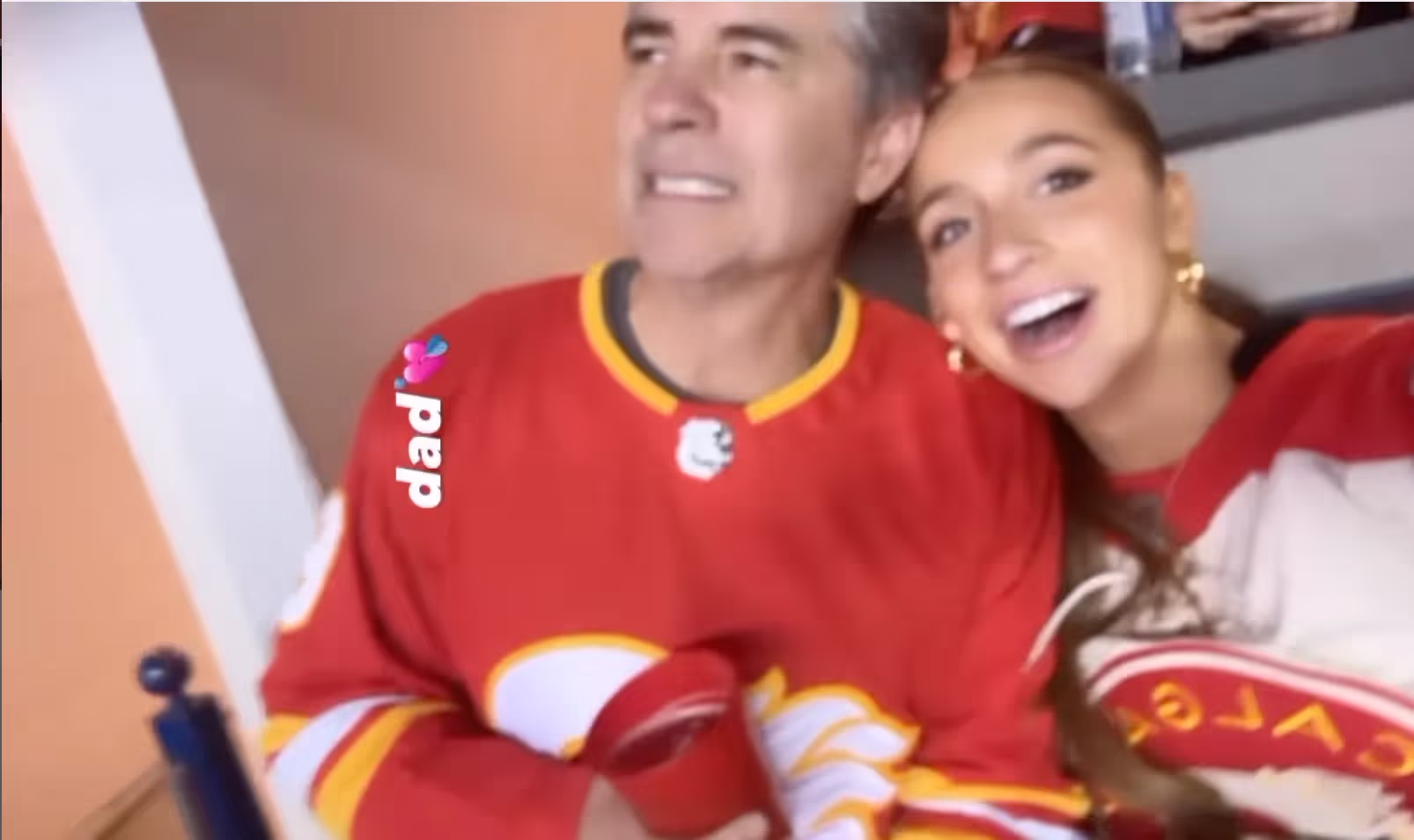 Tate McRae and her dad Todd cheering for Calgary "Flames" on December 16