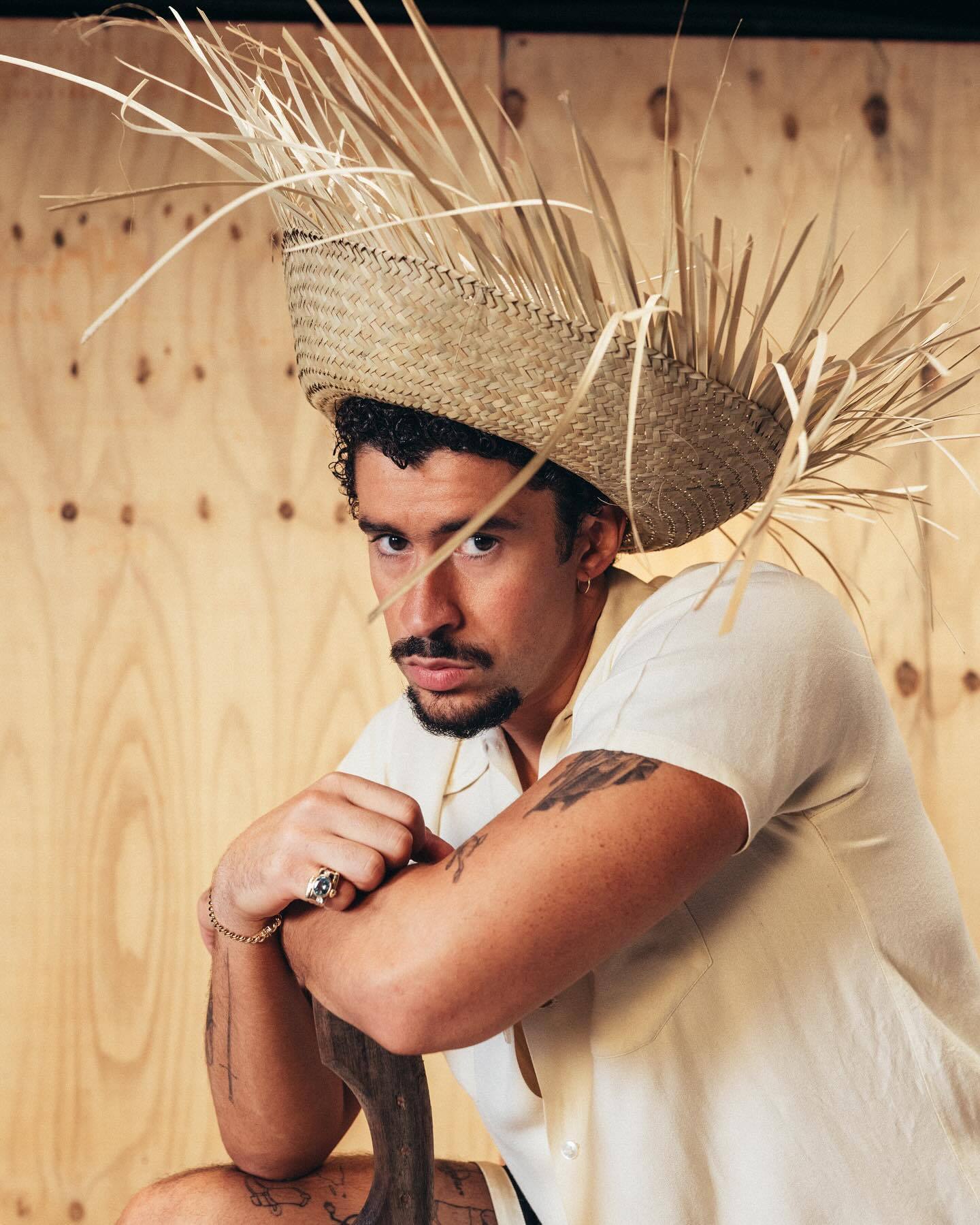 Bad Bunny in white t-shirt and straw hat, DeBÍ TiRAR MáS FOTos press kit, 2025