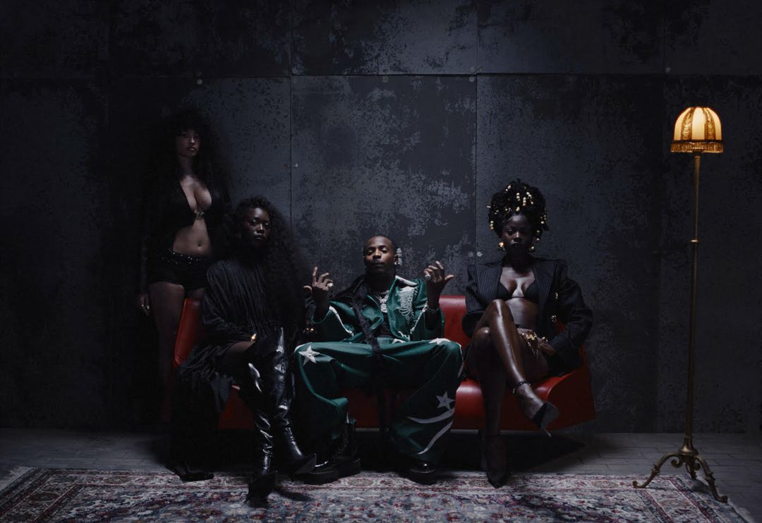 Young John, "Che Che" Music video still, featuring Asake