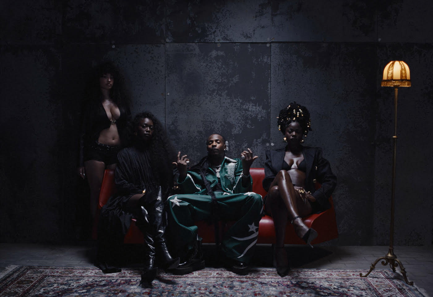 Young John, "Che Che" Music video still, featuring Asake