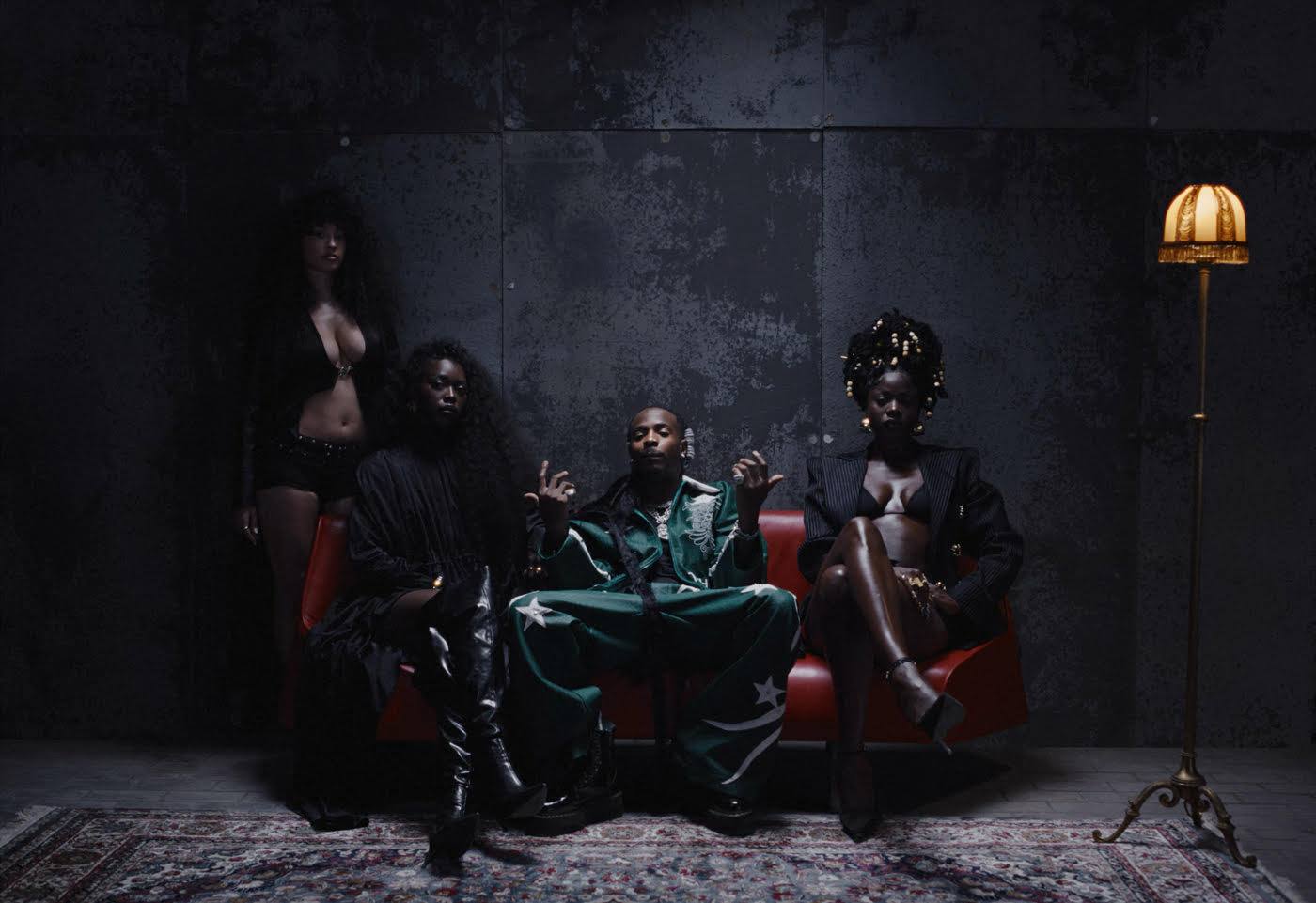 Young John, "Che Che" Music video still, featuring Asake